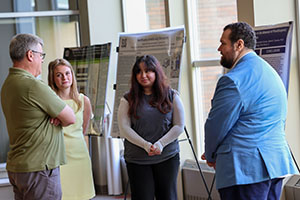 Honor's Social 2025 - 4 Photo of Faculty having a discussion