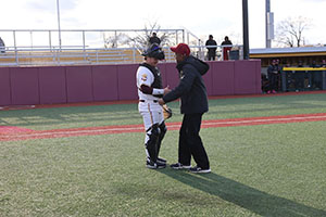 lance Johnson shaking hands with Triton catcher