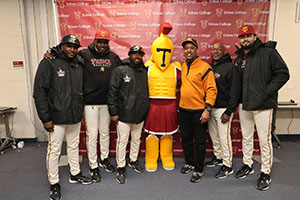 Troy the Mascot and Lance Johnson posing with Baseball Caoches