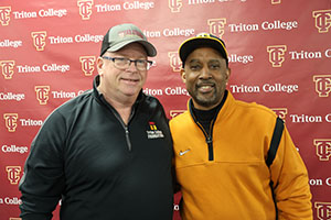 Lance Johnson posing with Alumni Member