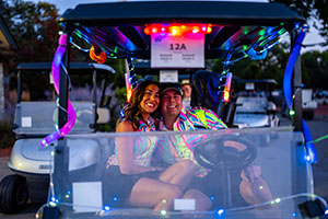 Couple golfers ready for tee off in their cart 
