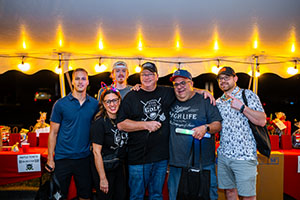 Raffle prize winners receiving their gifts