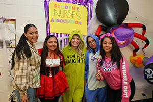 Triton Nurses Association dressed in costume at Trunk or Treat in Space Event