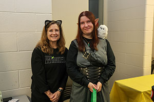 Triton employee and alumna dressed in costume at Trunk or Treat