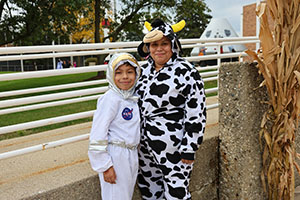 Kids dressed in costume for Halloween at Trunk or Treat in space