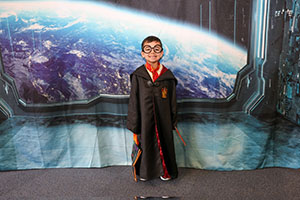 Kid dressed as Harry  Potter at Trunk or Treat in space event 