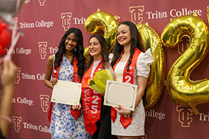 AE Graduation 2025 - 3 Photo of Graduates holding diplomas