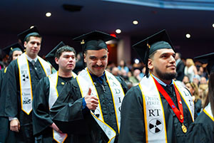 Photo of Graduate giving a thumbs up
