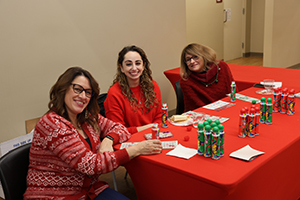 Photo of staff at Bingo Table with cards and supplies
