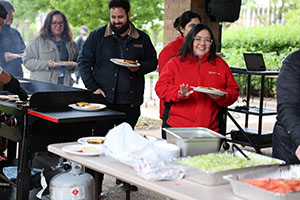 Photo of employees in line for food