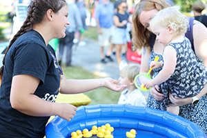 Fall Family Fun Fest - 6 Photo of little girl and her mother pulling plastic duck from a pool