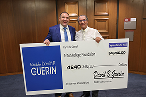 River Grove Scholarship Fund - 2 Photo of Mayor Guerin with Tom Olson posing with giant check
