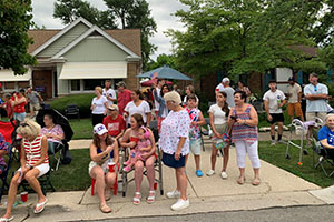 Westchester Parade 2025 - 3 Photo of viewers standing on curb waiting for parade