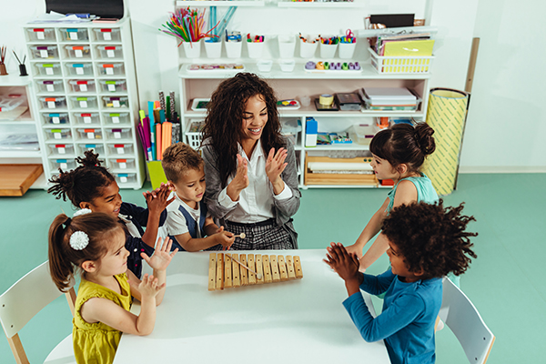 Teacher with Children at Table